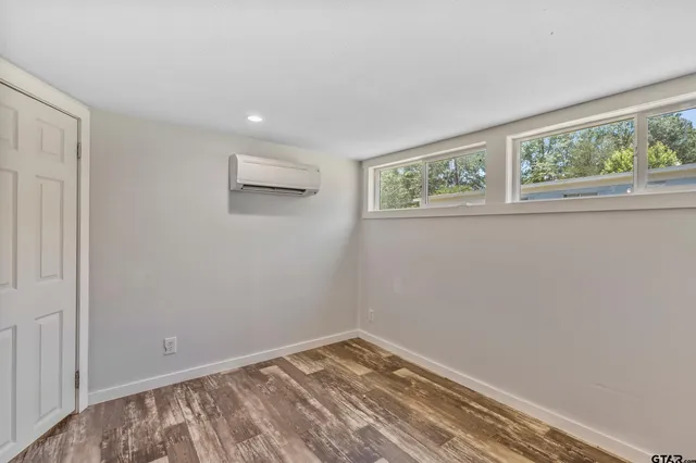 a view of room with window and hardwood floor