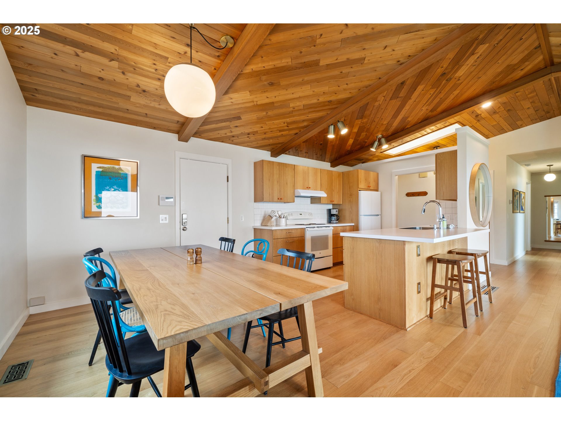1100 Arthurs Road Oceanside, OR 97141 - Photo 23 of 48 a dining room with furniture and wooden floor