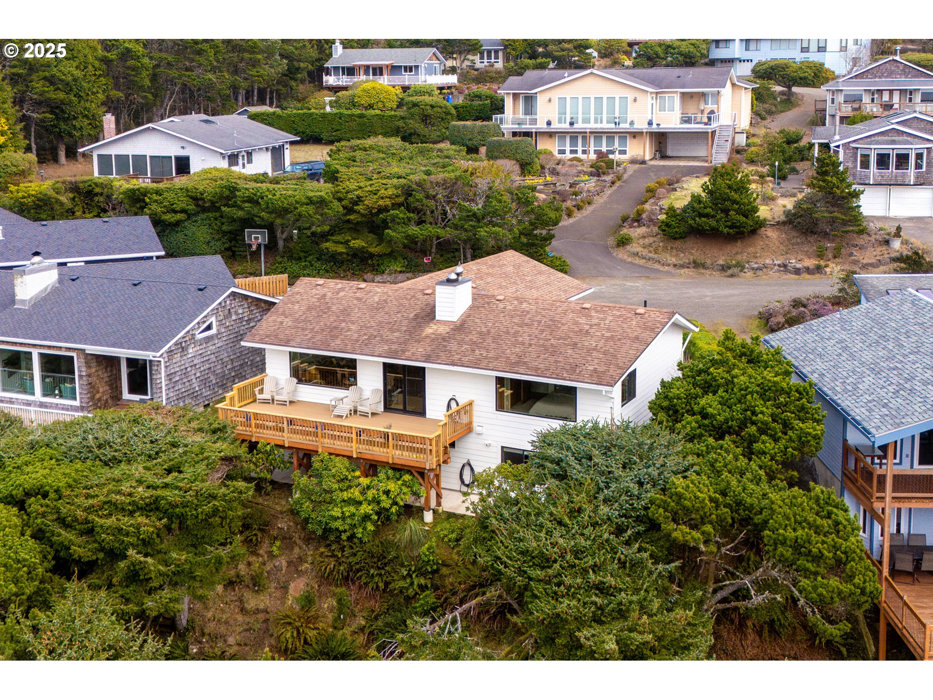 1100 Arthurs Road Oceanside, OR 97141 - Photo 3 of 48 a aerial view of a house with a yard and plants