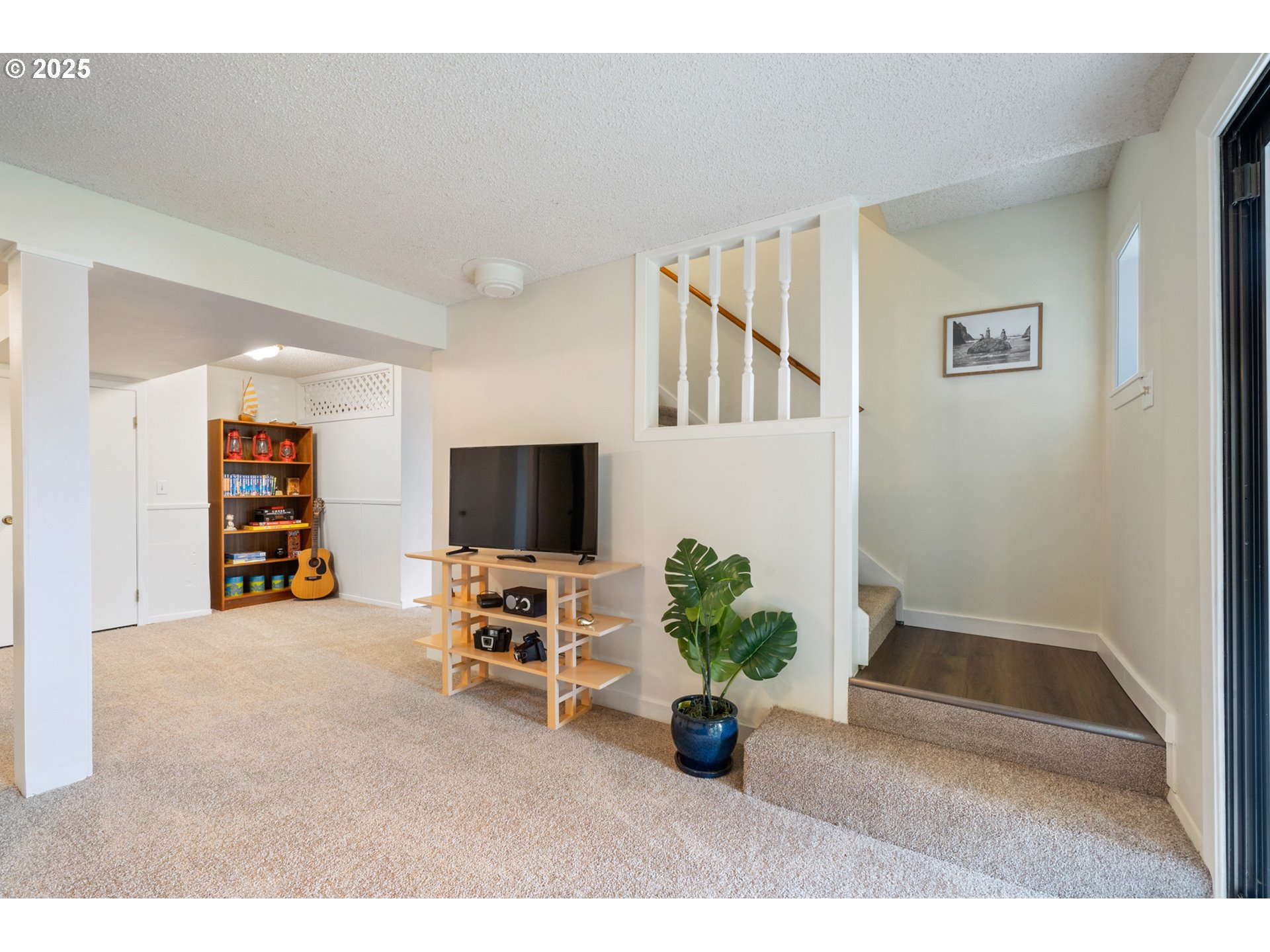 1100 Arthurs Road Oceanside, OR 97141 - Photo 31 of 48 a view of a livingroom with furniture and a flat screen tv