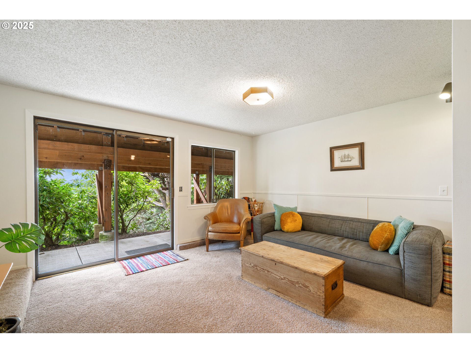 1100 Arthurs Road Oceanside, OR 97141 - Photo 32 of 48 a living room with furniture and a window