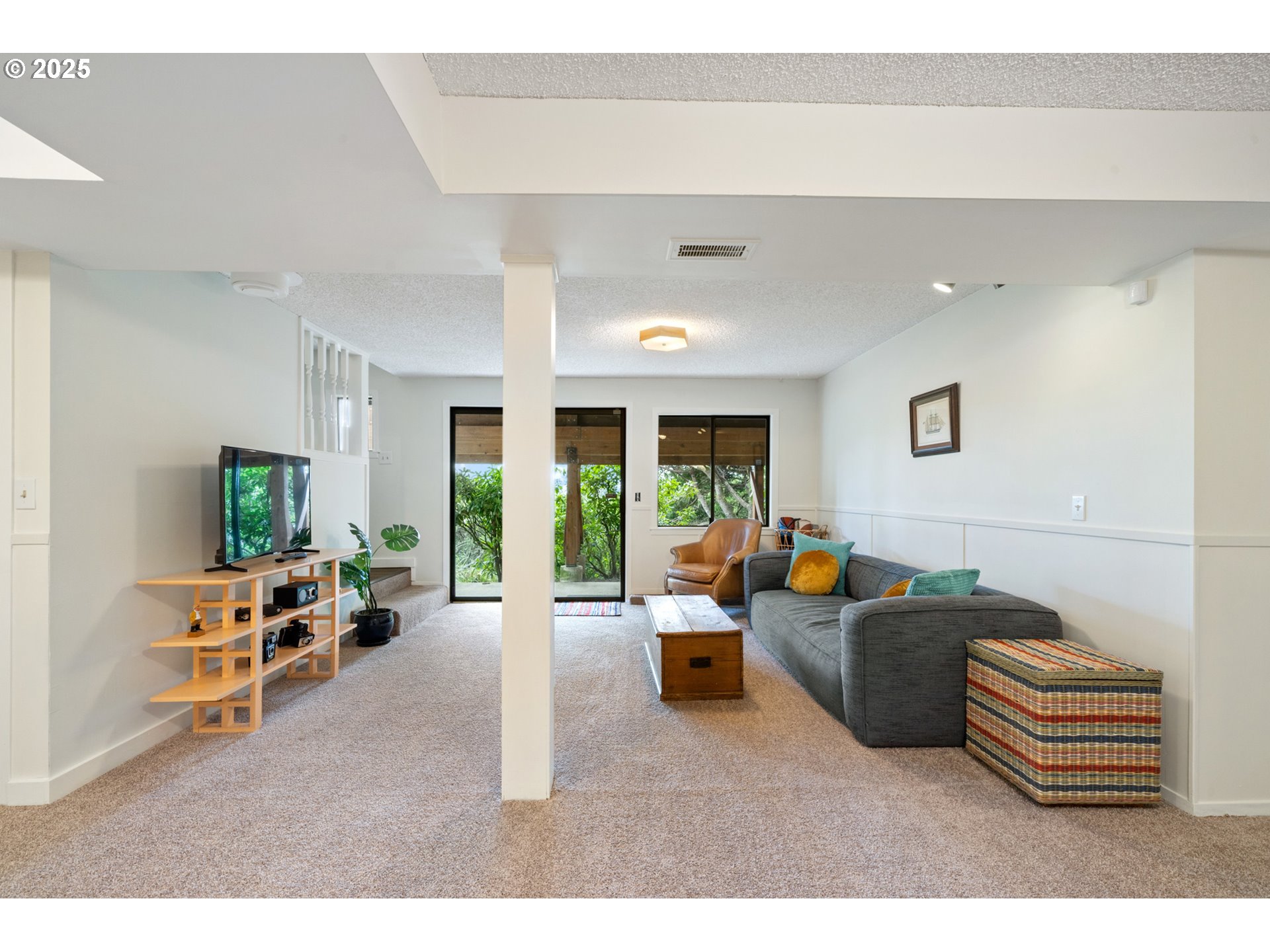 1100 Arthurs Road Oceanside, OR 97141 - Photo 33 of 48 a living room with furniture and a large window