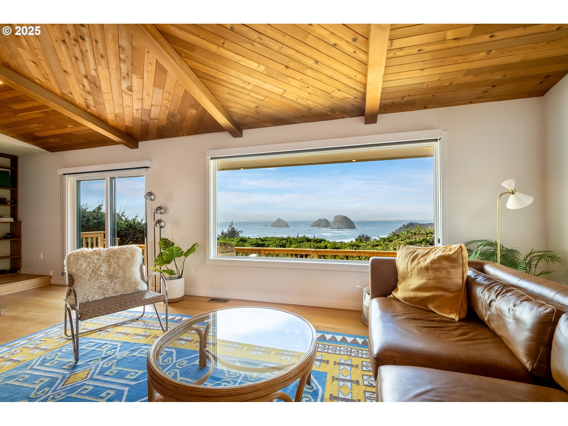 1100 Arthurs Road Oceanside, OR 97141 - Photo 10 of 48 a living room with a couch and a table