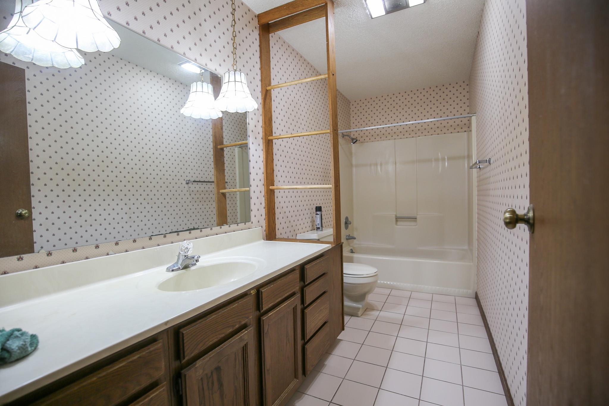 209 Fox Trot Dixon, IL 61021 - Photo 13 of 34 a bathroom with a sink a toilet and shower
