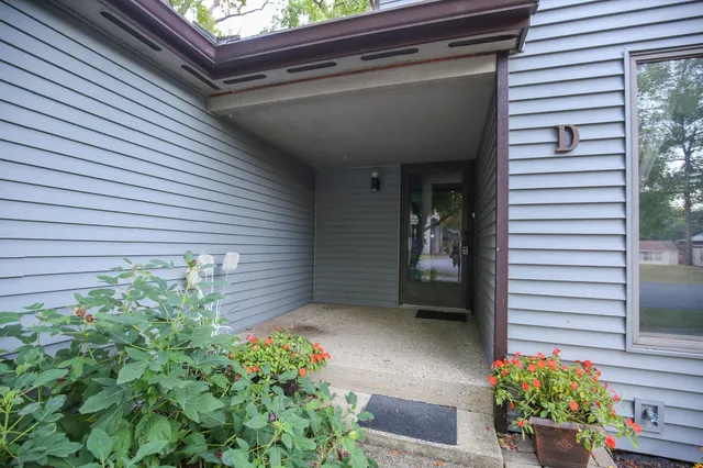 a view of a house with a flower garden