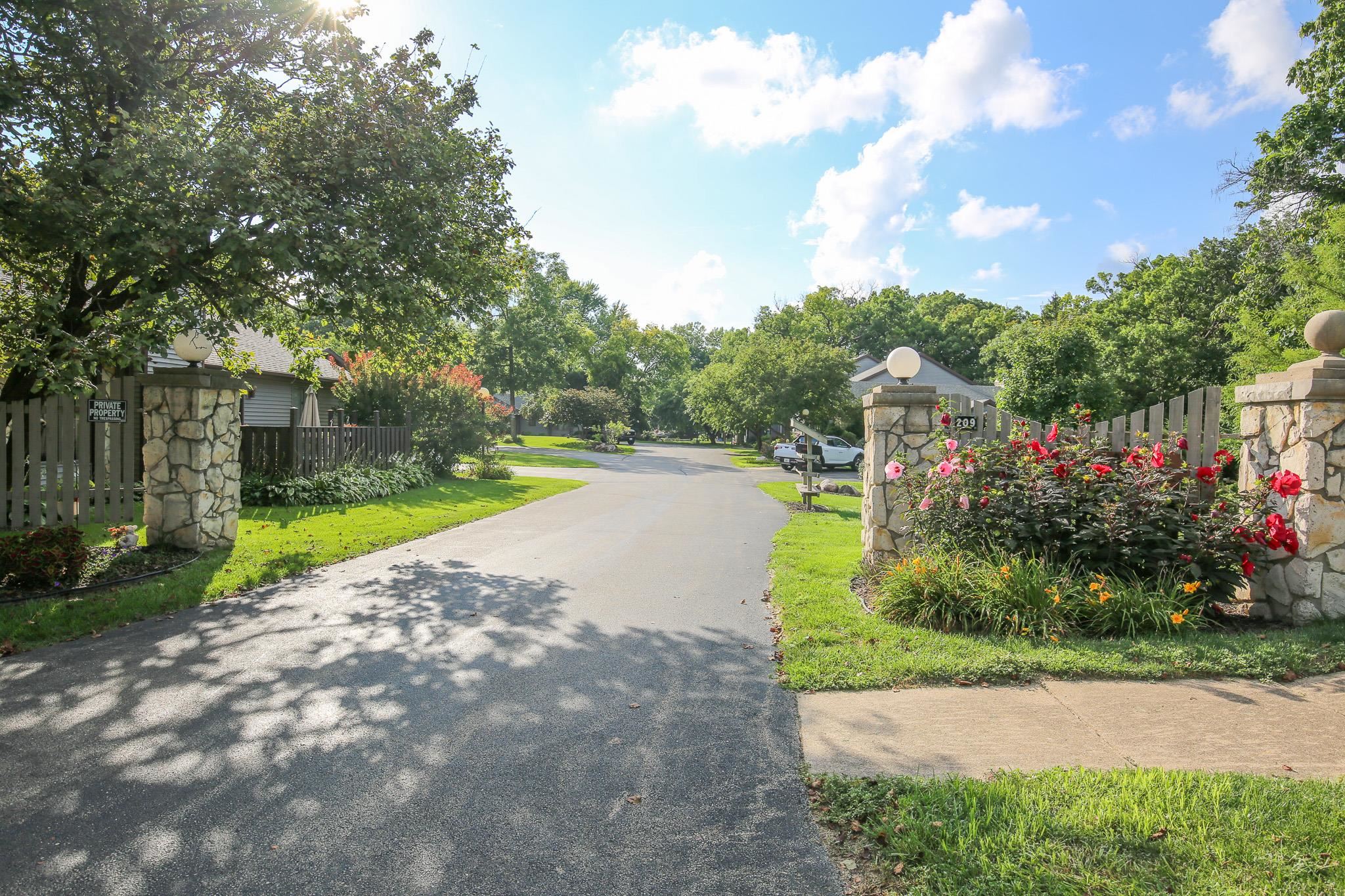 209 Fox Trot Dixon, IL 61021 - Photo 25 of 34 a view of a garden with a swimming pool
