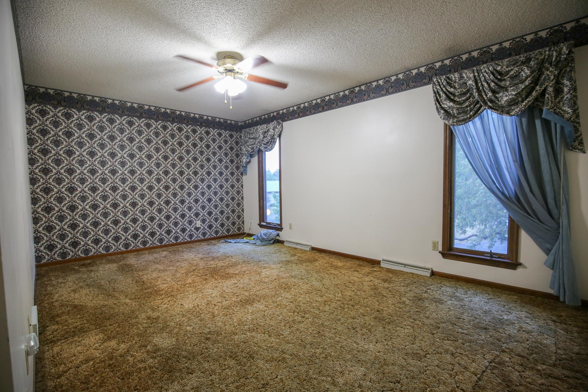 209 Fox Trot Dixon, IL 61021 - Photo 27 of 34 a view of a livingroom with a chandelier fan and fire place
