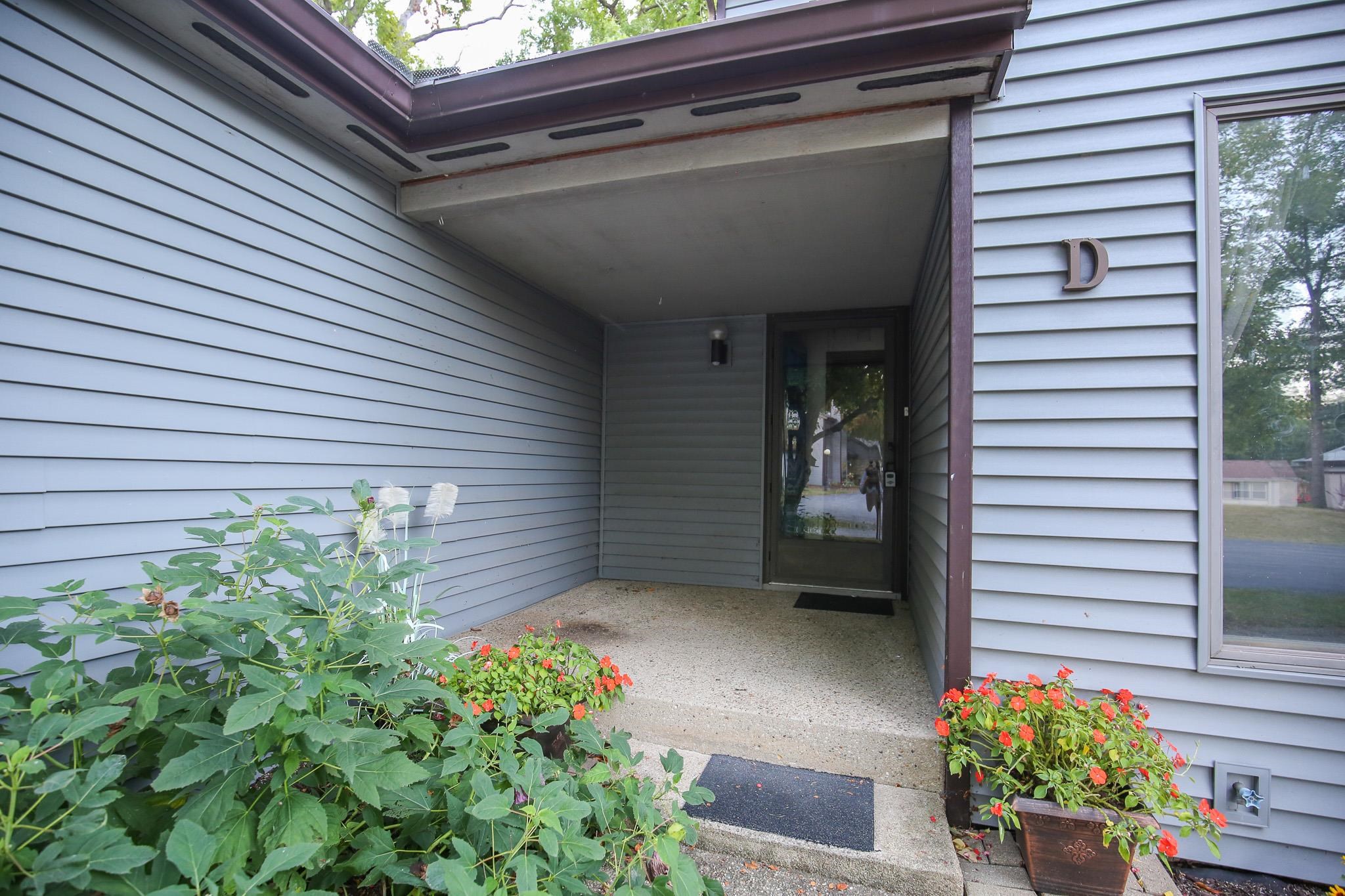 209 Fox Trot Dixon, IL 61021 - Photo 3 of 34 a view of a house with a flower garden