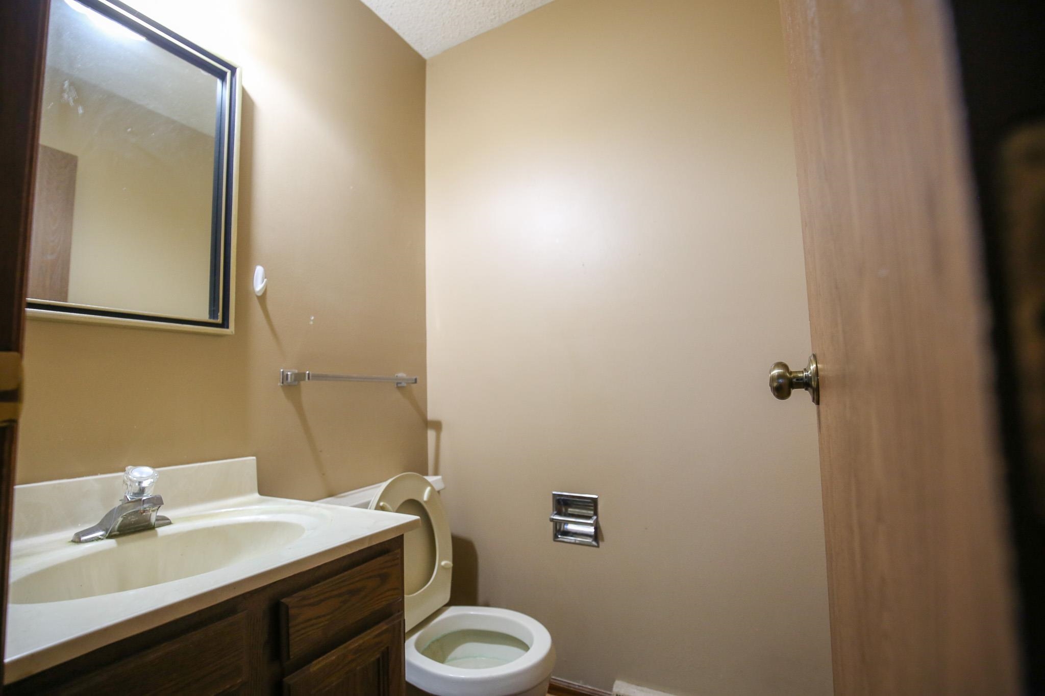 209 Fox Trot Dixon, IL 61021 - Photo 4 of 34 a bathroom with a sink toilet and mirror
