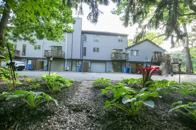 a view of house with yard and entertaining space