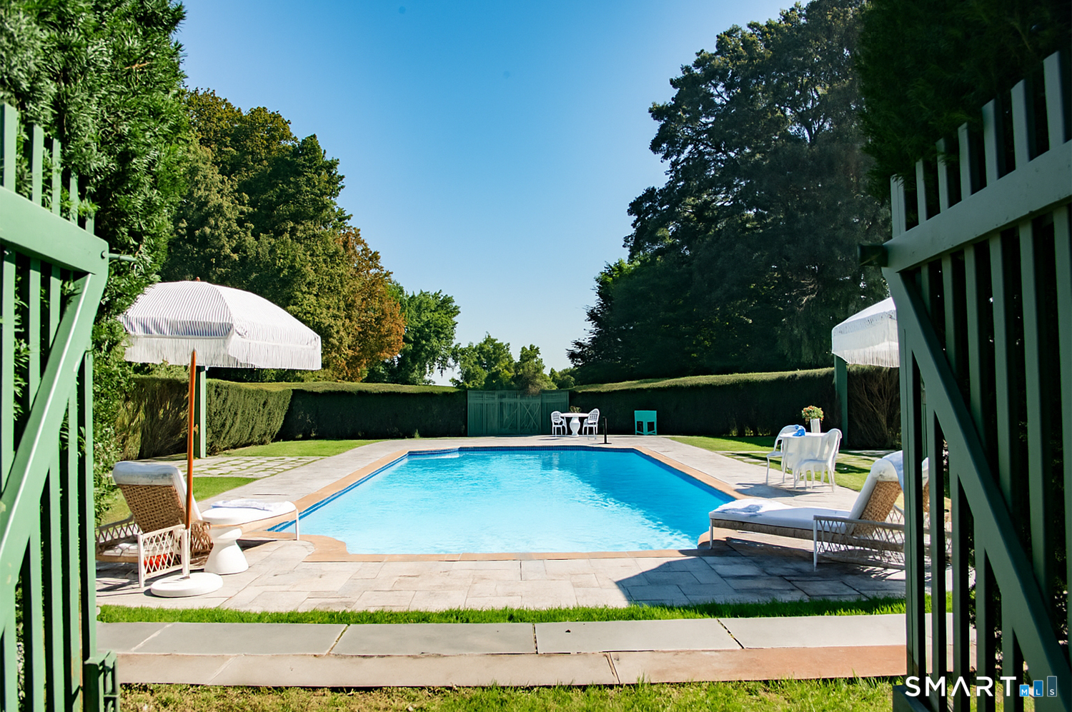 775 Sasco Hill Road Fairfield, CT 06824 - Photo 30 of 36 a view of a swimming pool with a patio