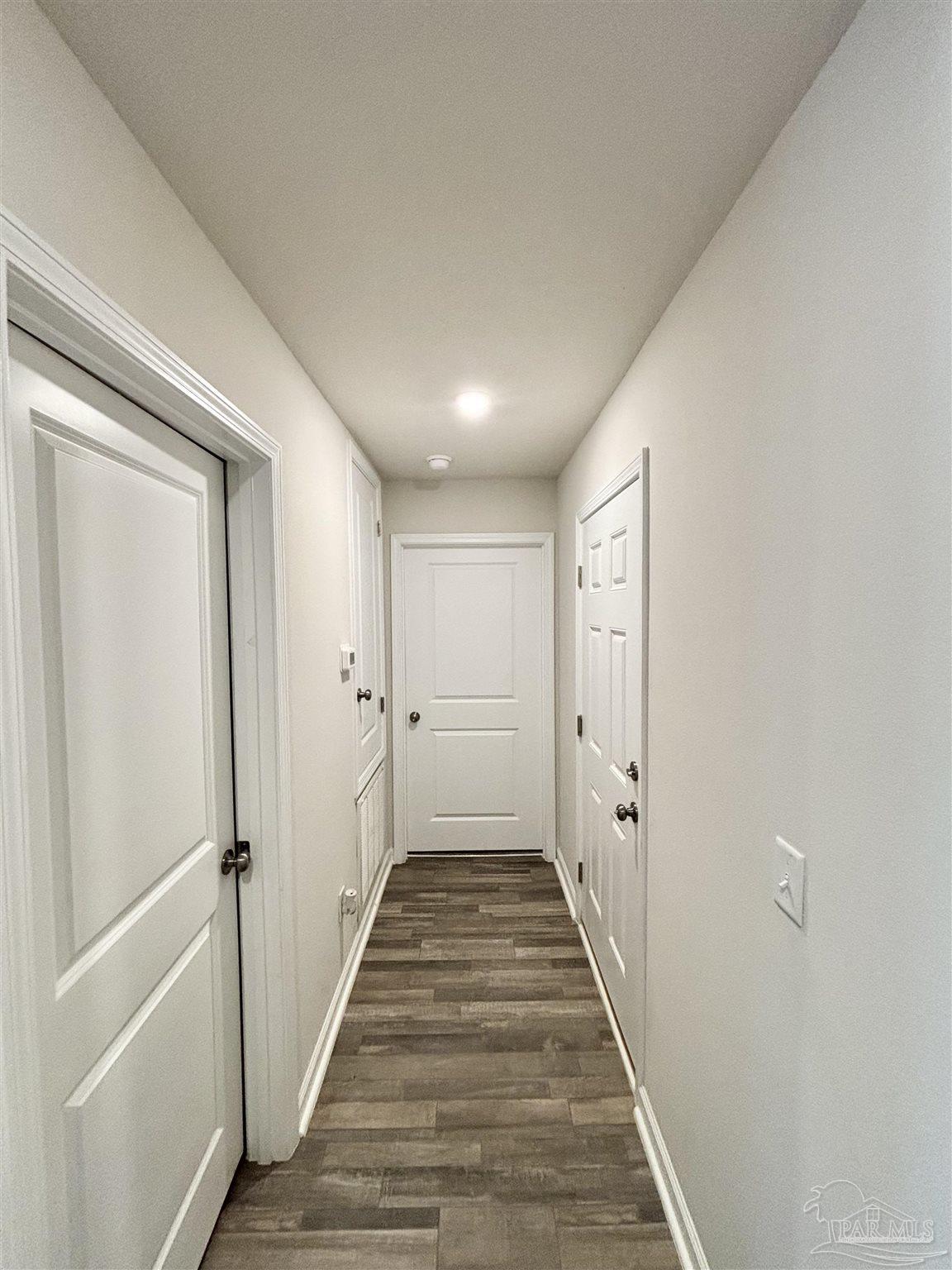 2164 Pineview Church Road Jay, FL 32565 - Photo 14 of 24 a view of a hallway with wooden floor and staircase