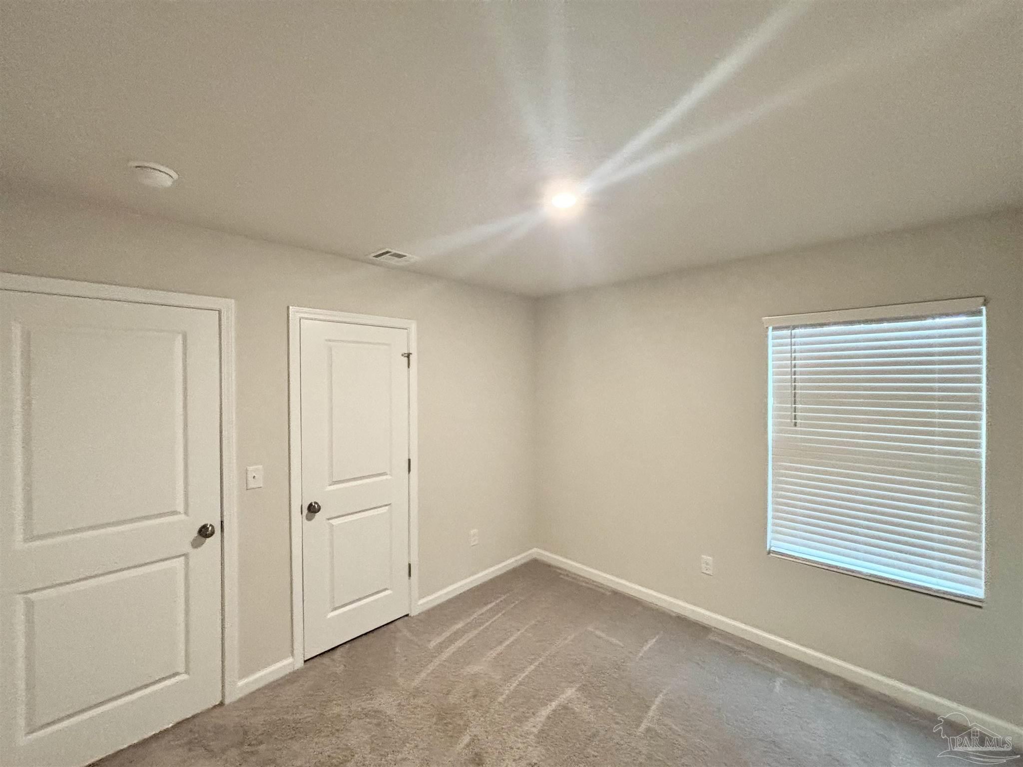 2164 Pineview Church Road Jay, FL 32565 - Photo 17 of 24 a view of an empty room with a window