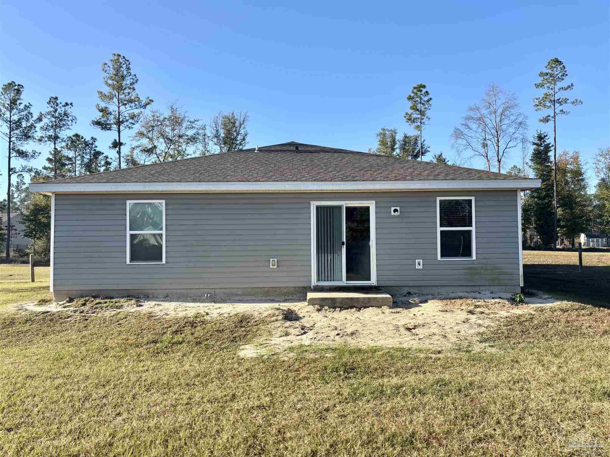 2164 Pineview Church Road Jay, FL 32565 - Photo 22 of 24 a front view of house with yard and trees in the background