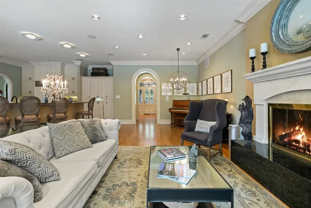 a bedroom with furniture and large windows