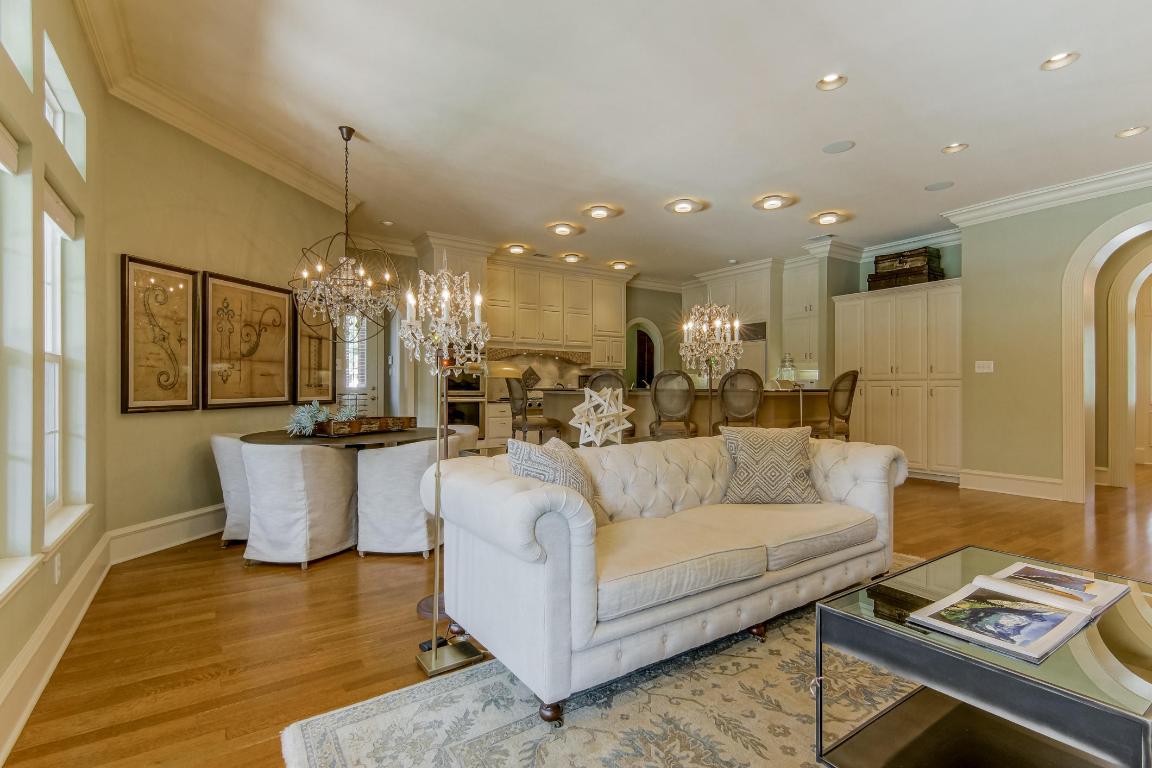 118 Lido Street Austin, TX 78734 - Photo 12 of 40 a living room with furniture and a chandelier