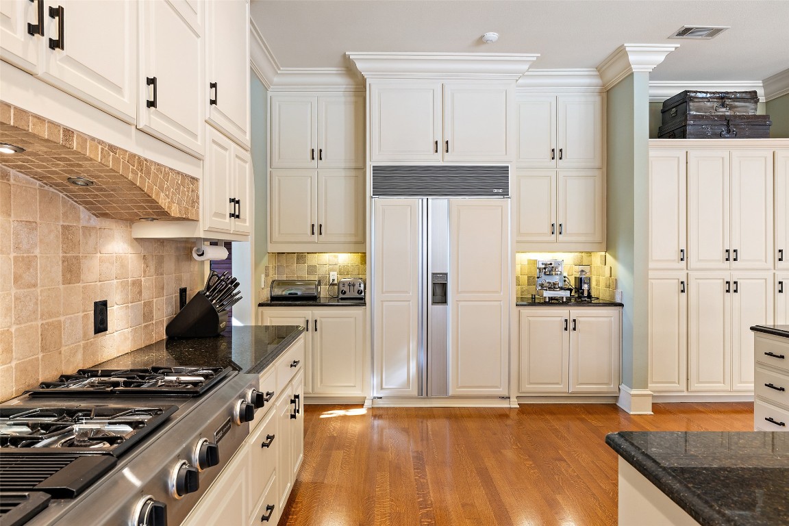 118 Lido Street Austin, TX 78734 - Photo 18 of 40 a kitchen with stainless steel appliances granite countertop a stove and a refrigerator