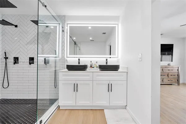 a bathroom with a sink and a mirror