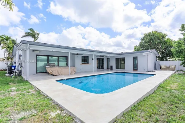 a view of a swimming pool with a patio