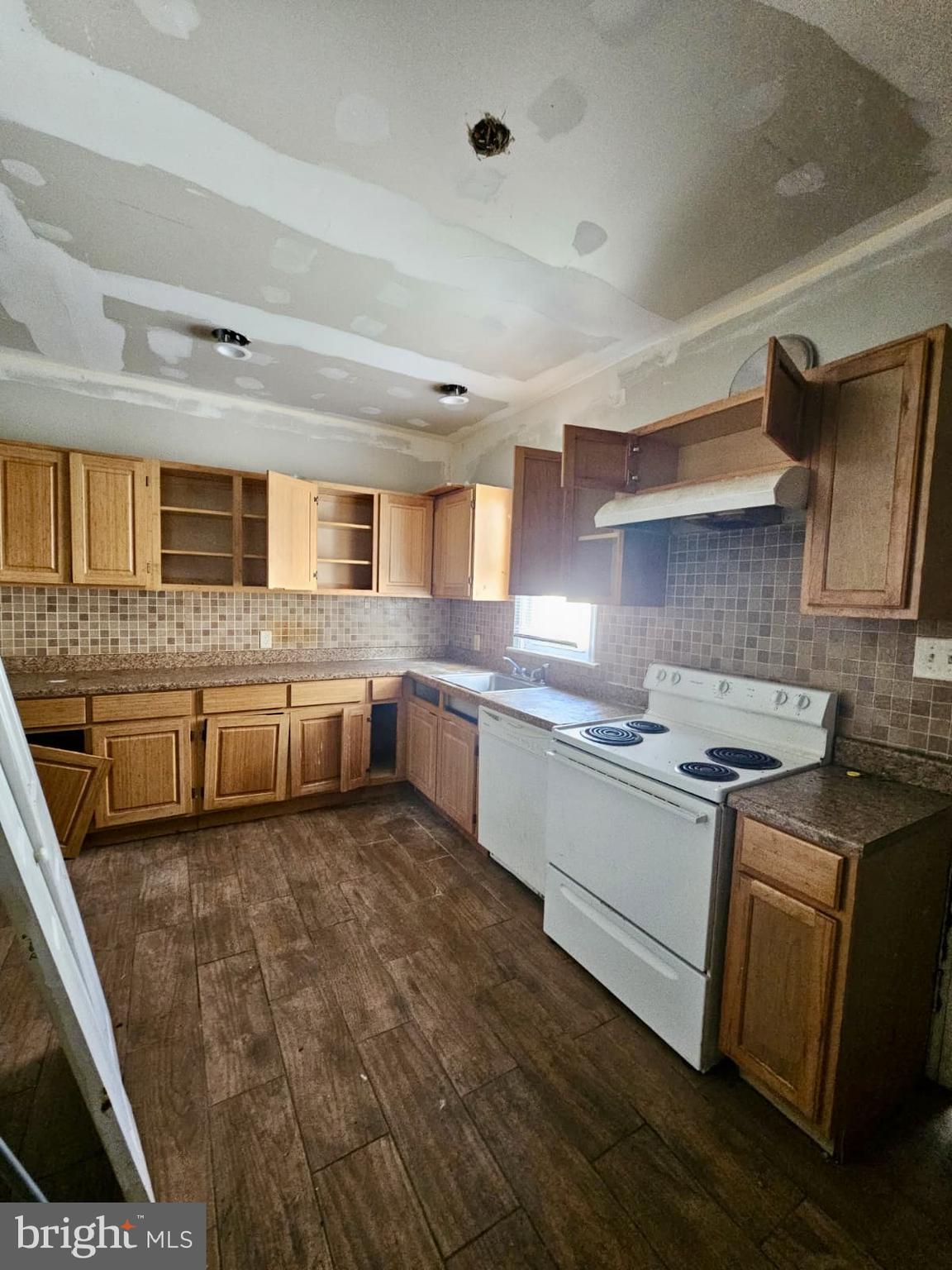 931 Kenmore Road Philadelphia, PA 19151 - Photo 4 of 11 a kitchen with stainless steel appliances granite countertop a sink and cabinets