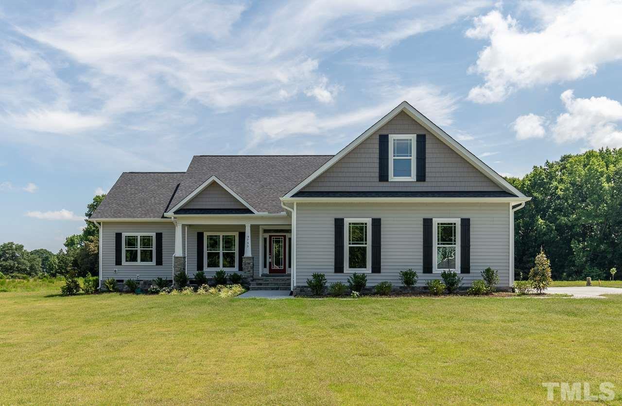 6733 Dwight Rowland Road Willow Spring, NC 27592 - Photo 2 of 25 Gorgeous home sits on 1.4 acres, side walk concrete drive and parking pad