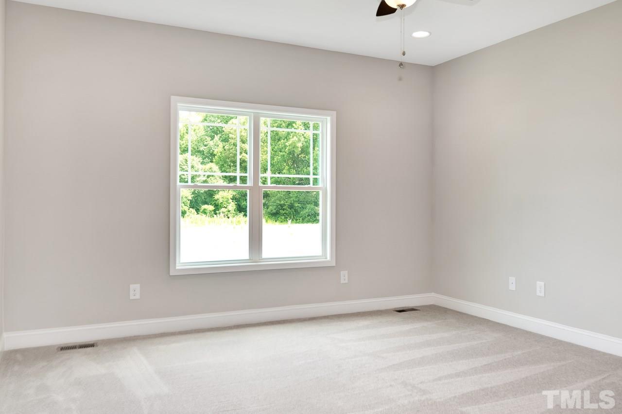 6733 Dwight Rowland Road Willow Spring, NC 27592 - Photo 14 of 25 spacious first floor master joins easy living master bath