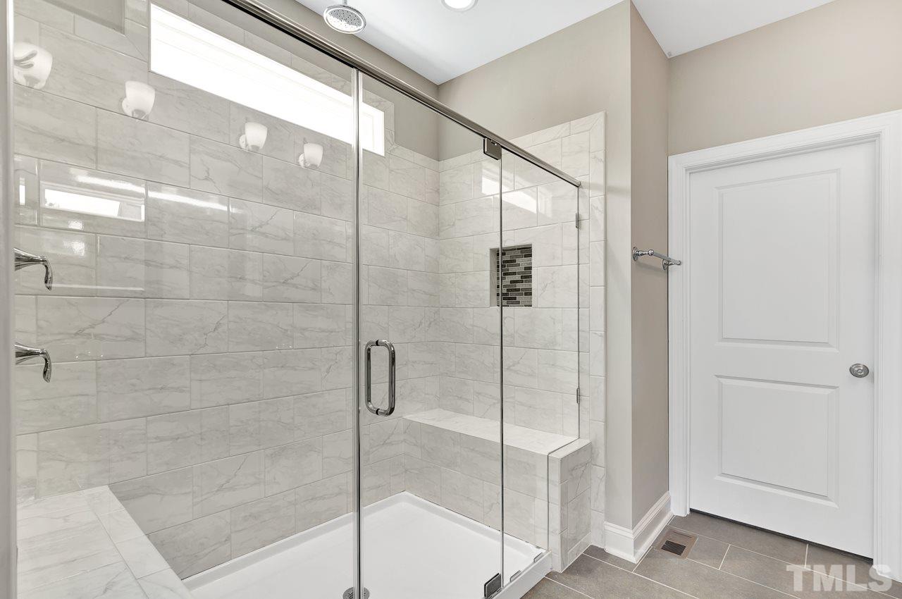 6733 Dwight Rowland Road Willow Spring, NC 27592 - Photo 15 of 25 tiled oversized shower with 2 seats