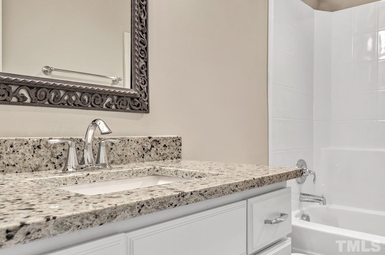 6733 Dwight Rowland Road Willow Spring, NC 27592 - Photo 21 of 25 large bath cabinet and fashionable countertop with tiled flooring