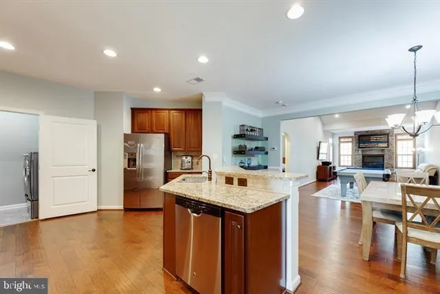 a large kitchen with a table and chairs