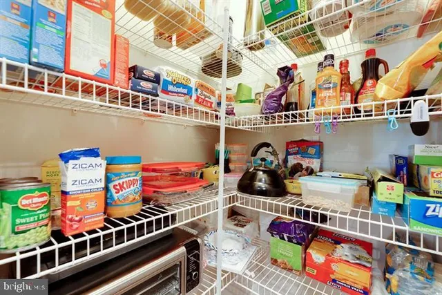 a living room with furniture pool table and flat screen tv