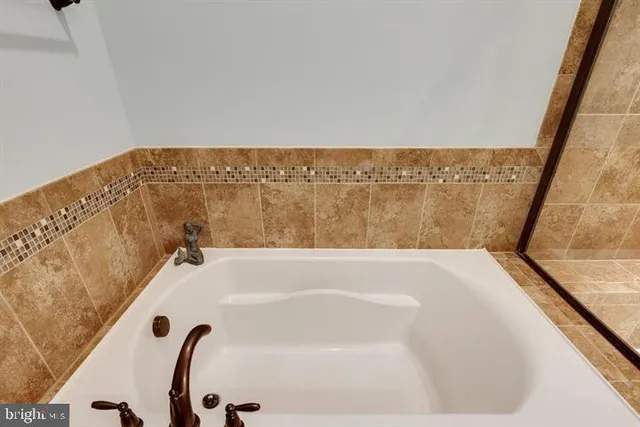 a bathroom with a sink double vanity and a mirror