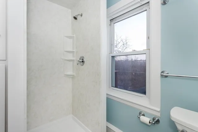 a bathroom with a granite countertop sink