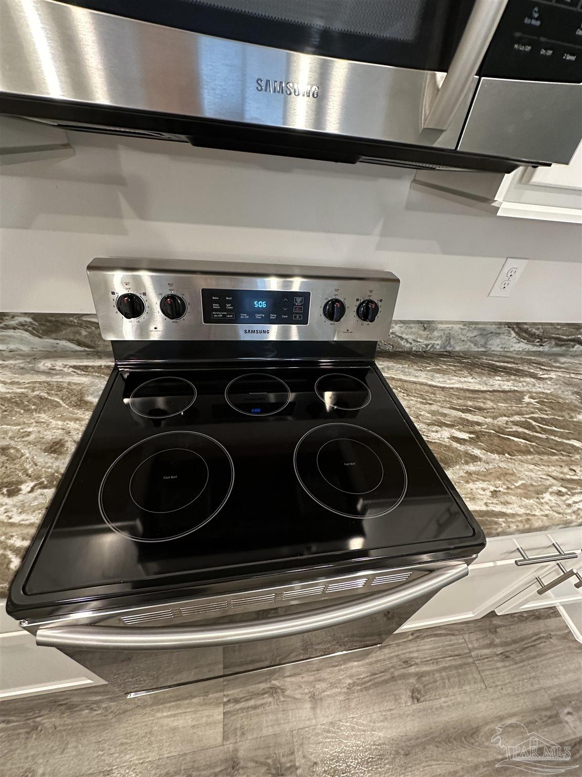 4466 Jude Way Pace, FL 32571 - Photo 8 of 27 2 Fast-Boil Burners in Front w/5th Burner Warmer!