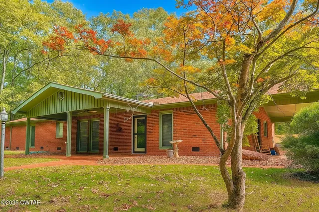 front view of a house with a big yard
