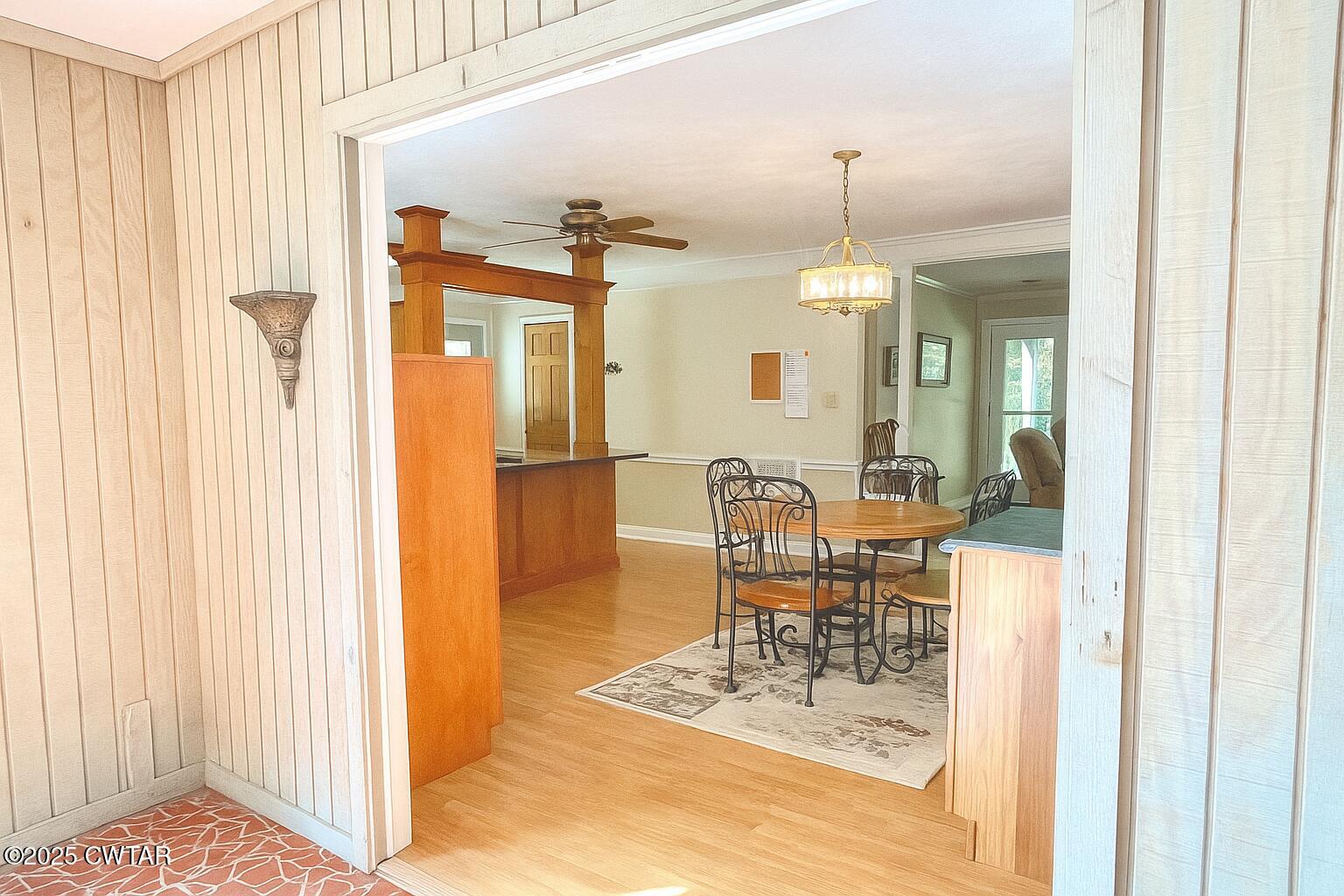 459 Liberty Road Beech Bluff, TN 38313 - Photo 13 of 32 a dining room with furniture a chandelier and wooden floor