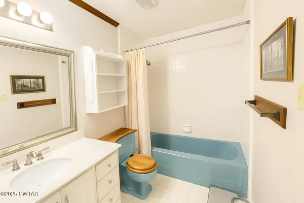 a bathroom with a sink a toilet and a bathtub