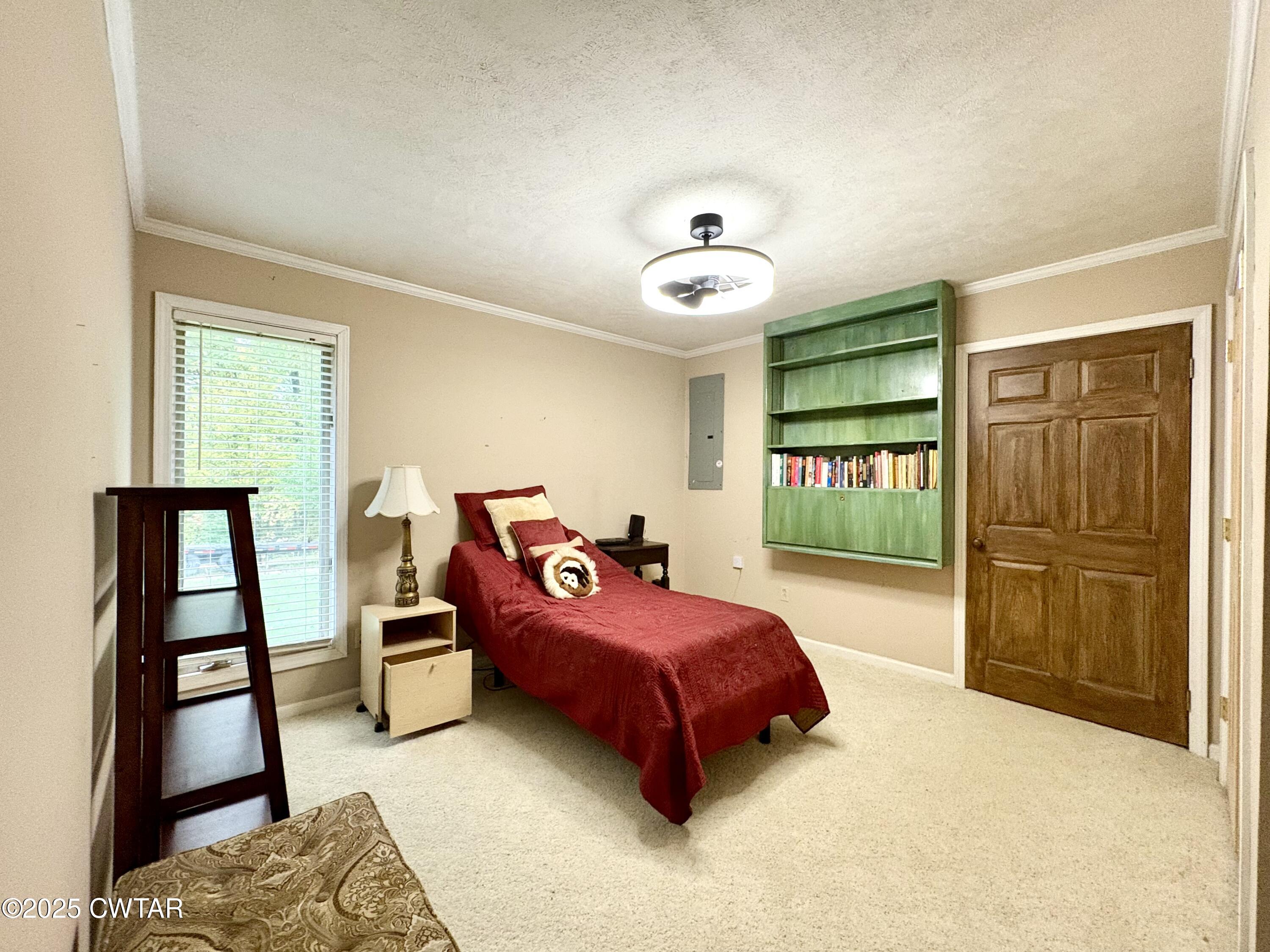 459 Liberty Road Beech Bluff, TN 38313 - Photo 20 of 32 a bedroom with a bed and a dresser