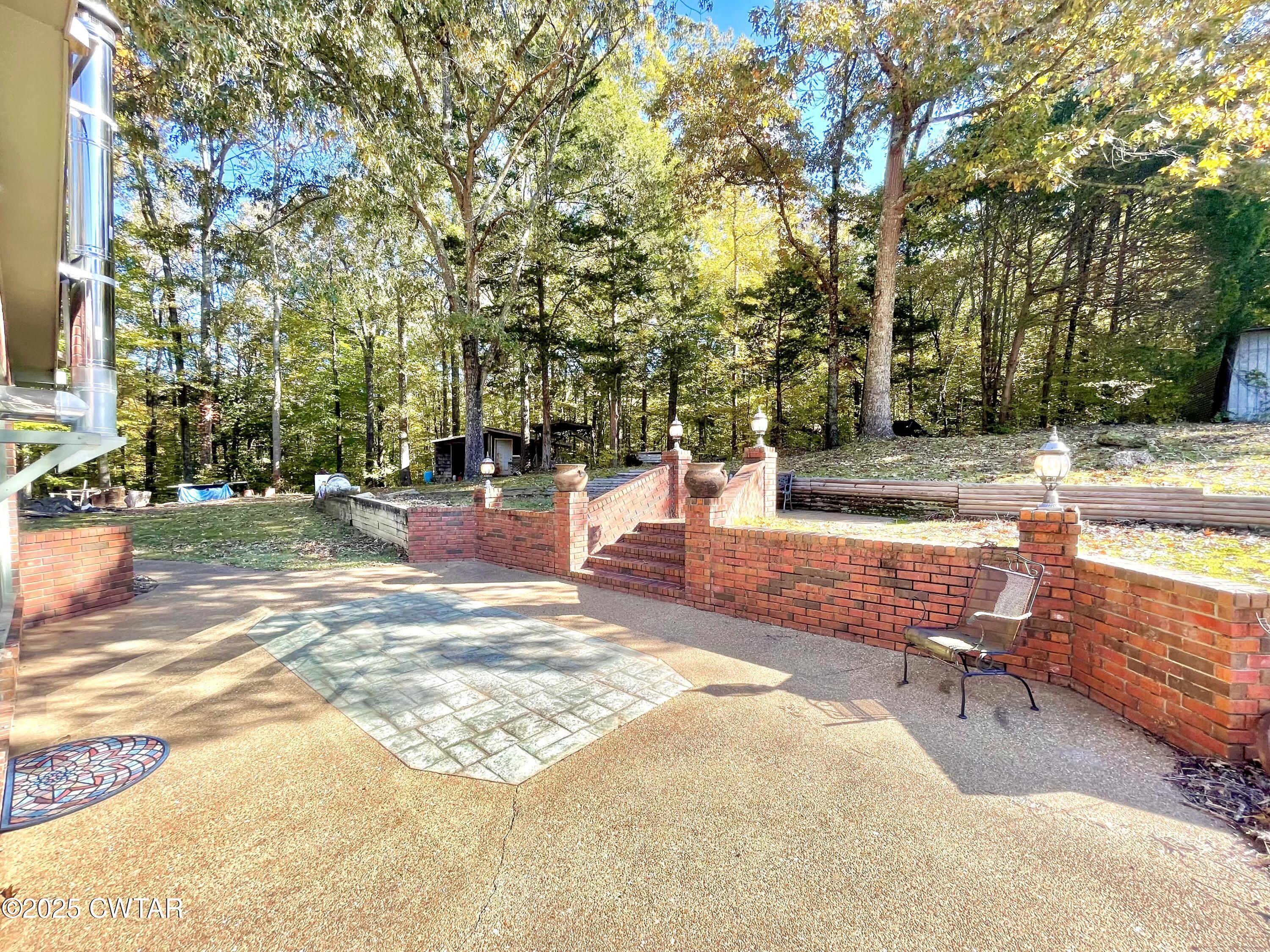 459 Liberty Road Beech Bluff, TN 38313 - Photo 24 of 32 a view of a swimming pool with a patio