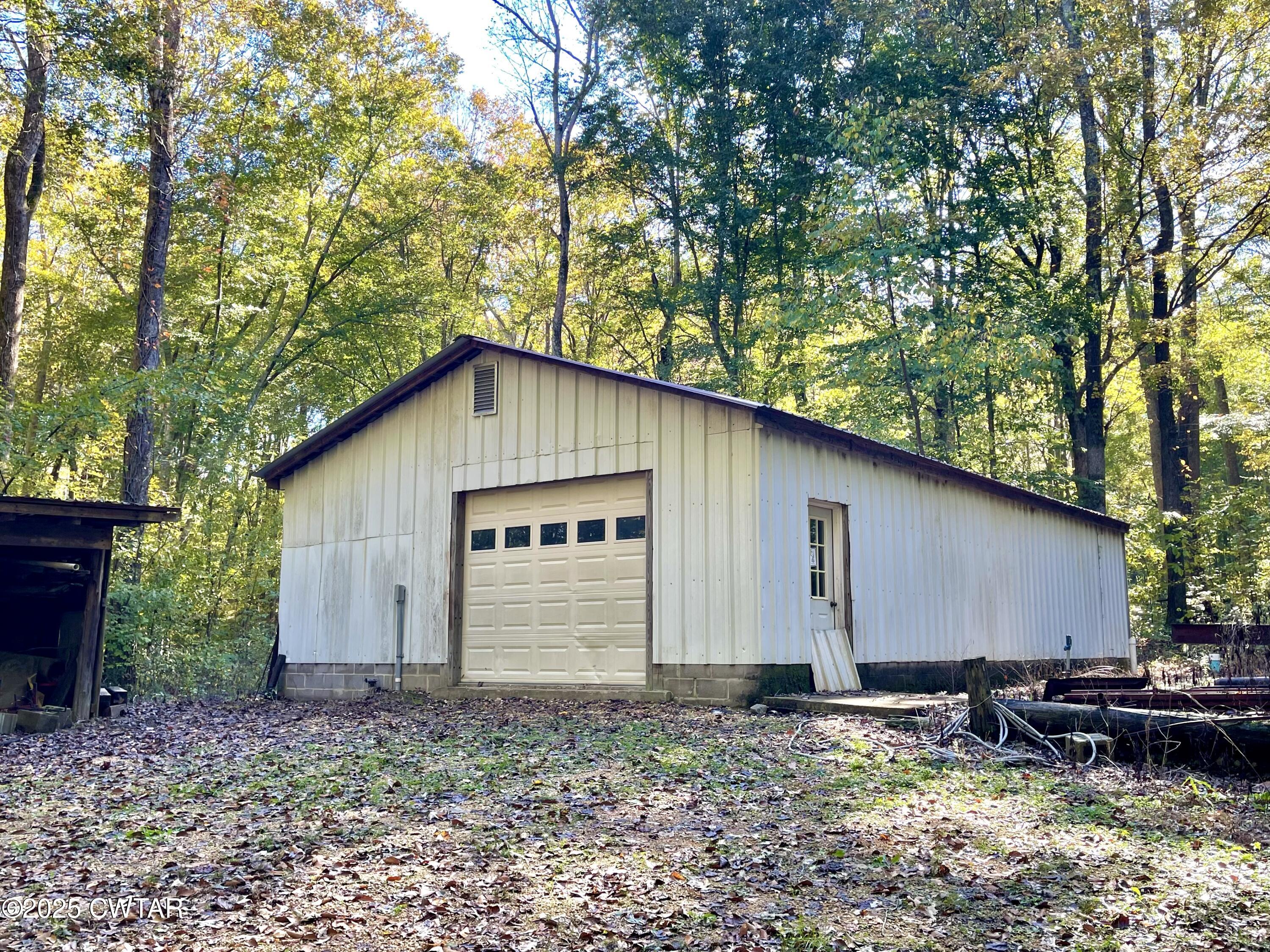 459 Liberty Road Beech Bluff, TN 38313 - Photo 30 of 32 a backyard of a house with yard and outdoor seating