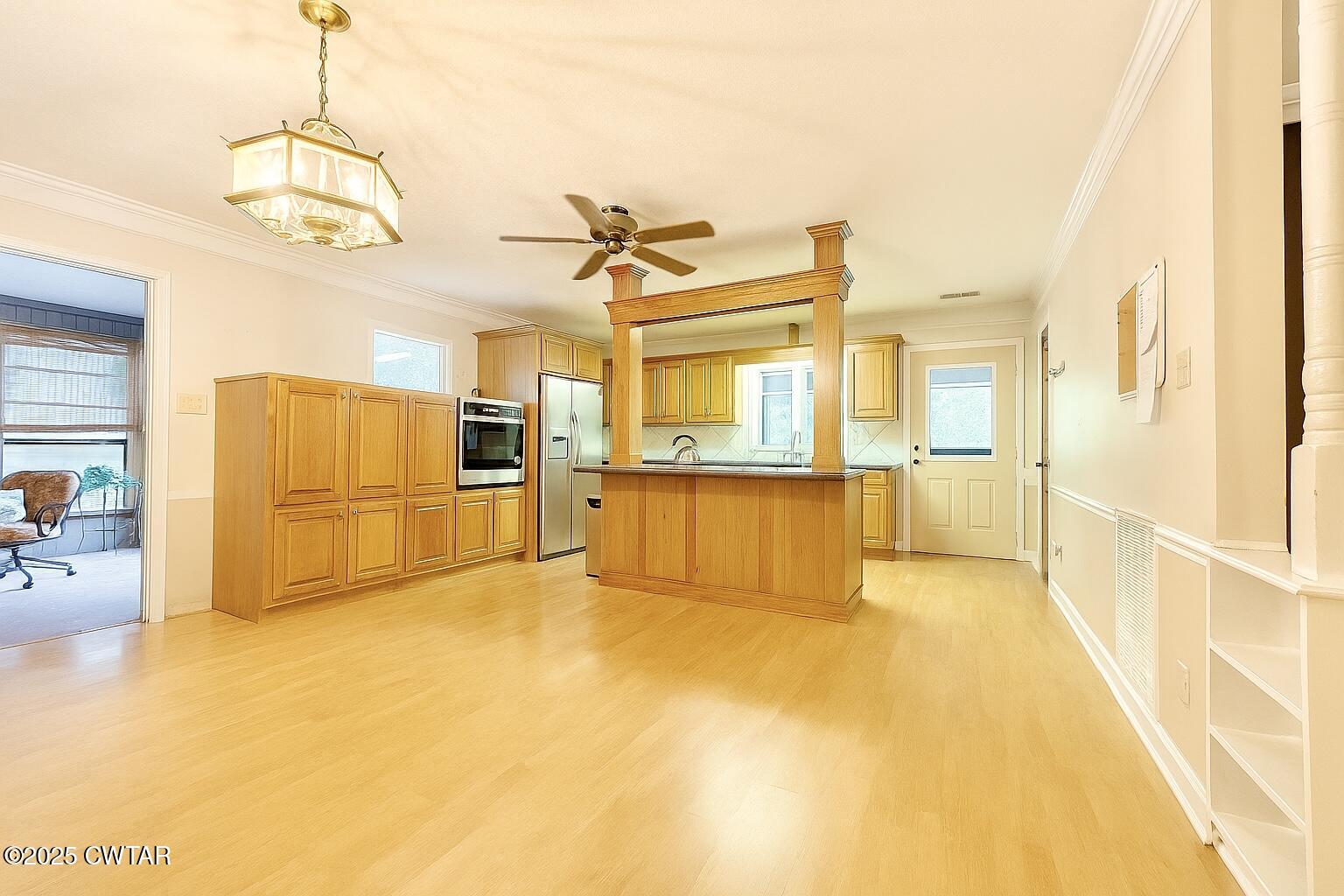 459 Liberty Road Beech Bluff, TN 38313 - Photo 7 of 32 a view of a kitchen with a sink and refrigerator