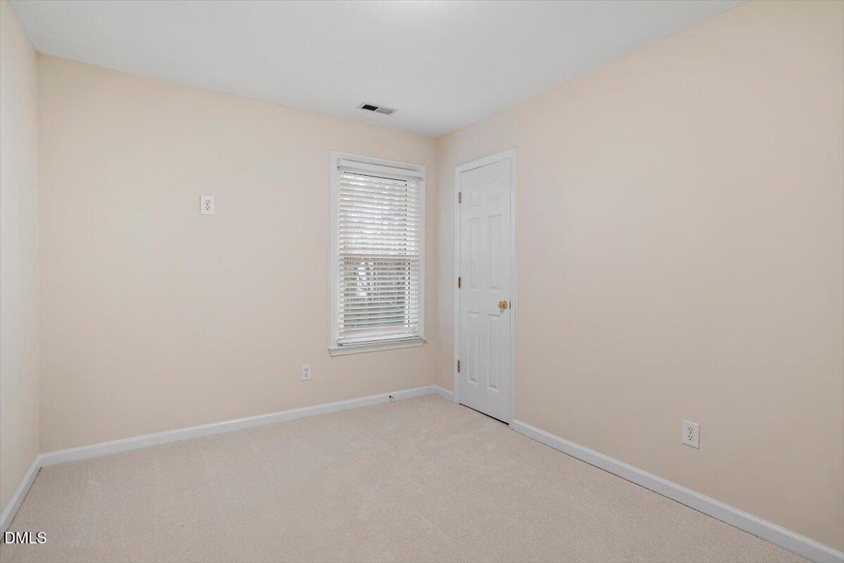 2628 Crofton Springs Drive Raleigh, NC 27615 - Photo 28 of 33 an empty room with a window
