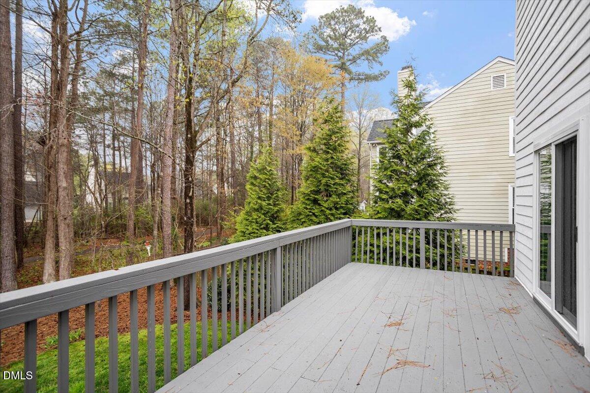 2628 Crofton Springs Drive Raleigh, NC 27615 - Photo 30 of 33 a view of a balcony with wooden fence and floor