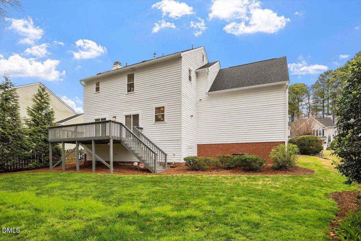 2628 Crofton Springs Drive Raleigh, NC 27615 - Photo 31 of 33 a view of a house with a backyard