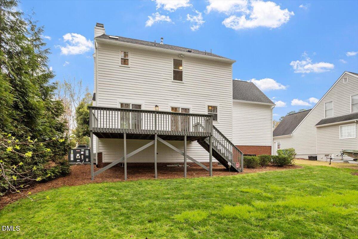 2628 Crofton Springs Drive Raleigh, NC 27615 - Photo 33 of 33 a view of a house with a backyard