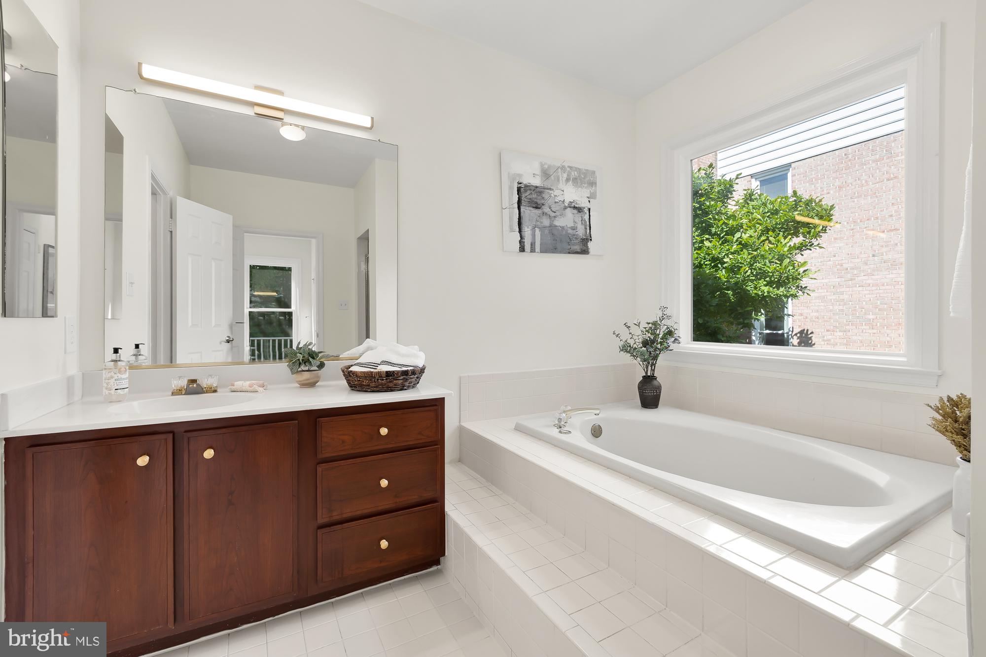 8909 Bells Mill Road Potomac, MD 20854 - Photo 34 of 71 Main level en suite bathroom with tub and shower