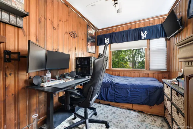 a view of a livingroom with furniture and a window