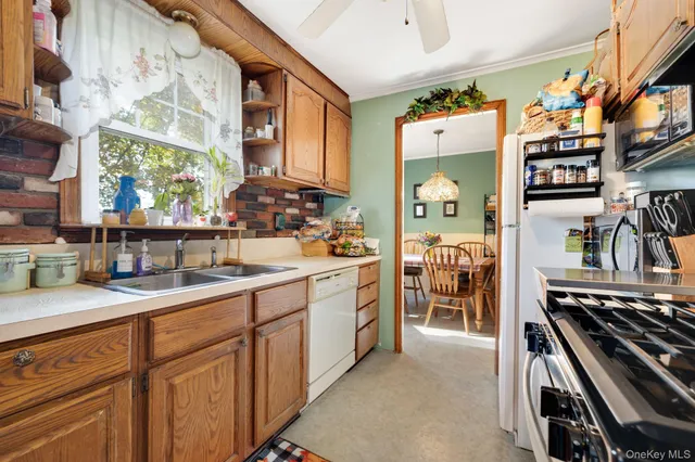 a kitchen with sink cabinets and stove