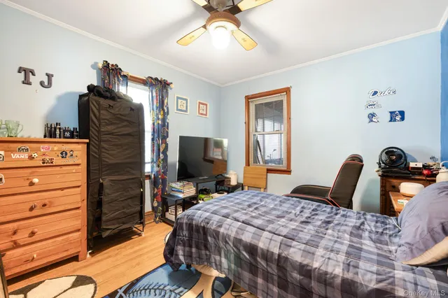 a bedroom with a bed and a television