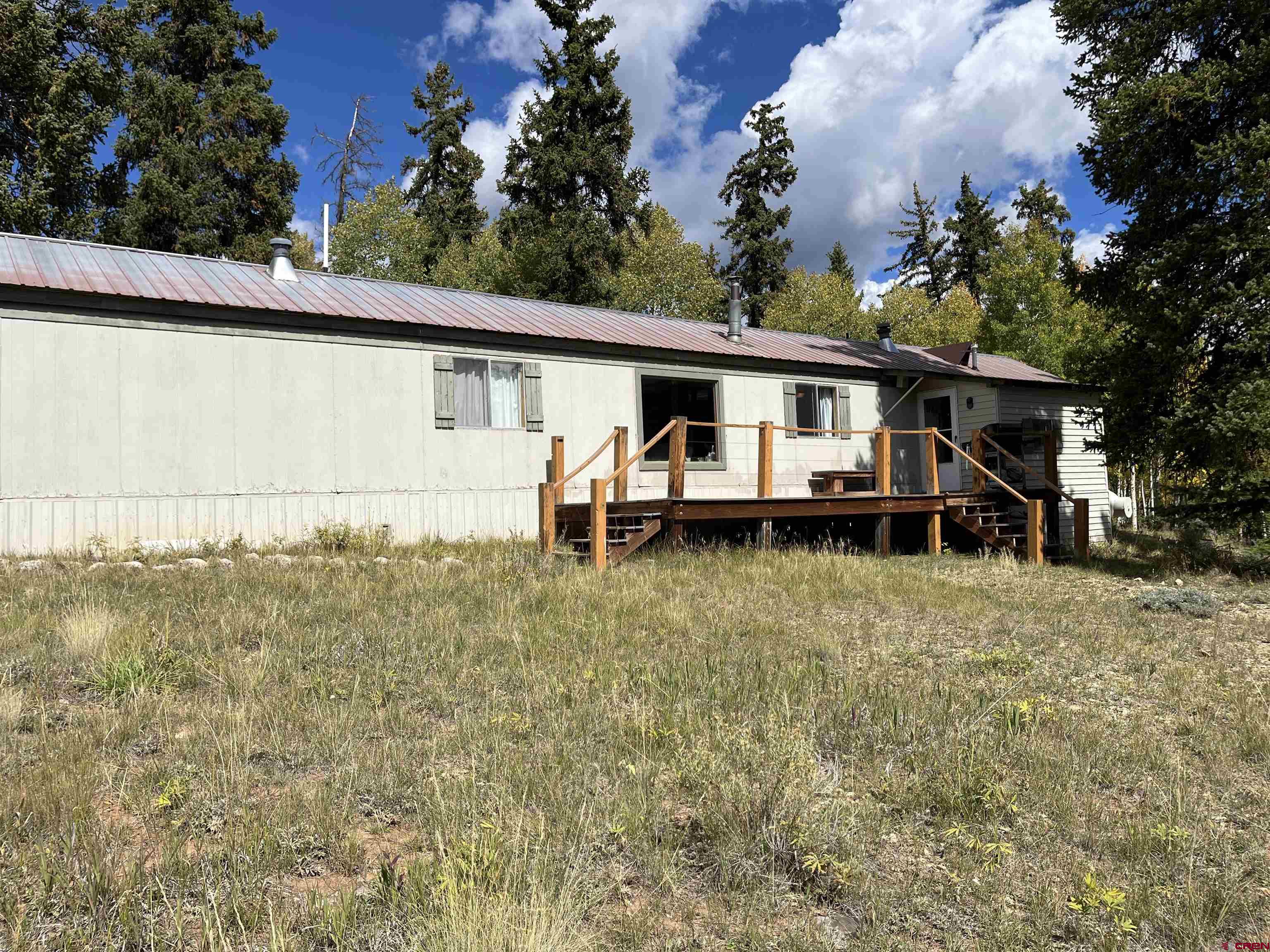 320 Forest Service Road Pitkin, CO 81241 - Photo 15 of 16 a view of a house with a yard