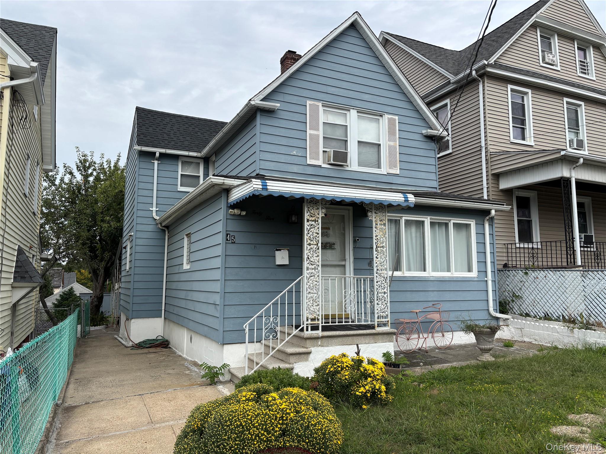 45 John Street New Rochelle, NY 10805 - Photo 1 of 14 a front view of a house with garden